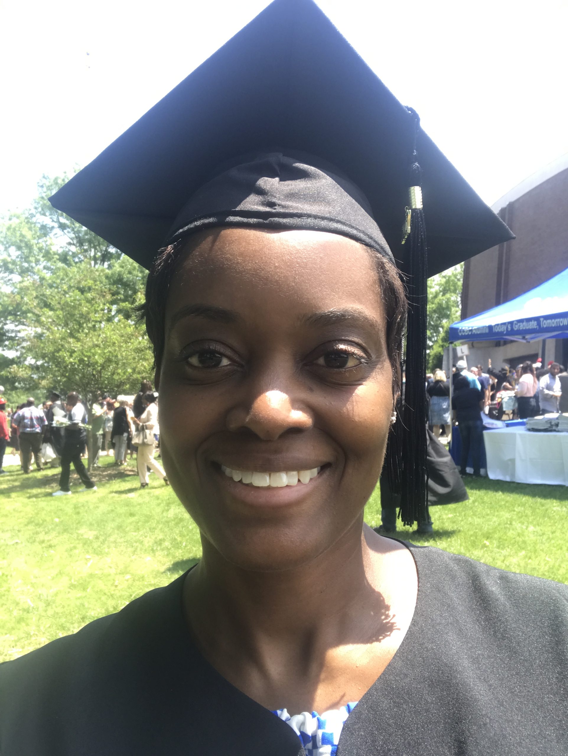 Me in a cap and gown at my community college graduation—29 years after I first started college.