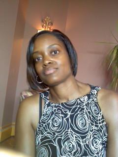 A younger woman with chin-length , dark hair, smiling —a snapshot of youth and confidence.

