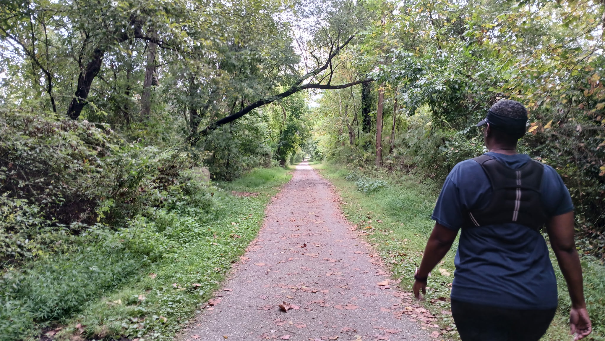 Tami Zanele walking on path, balancing consistent movement with sustainable progress.